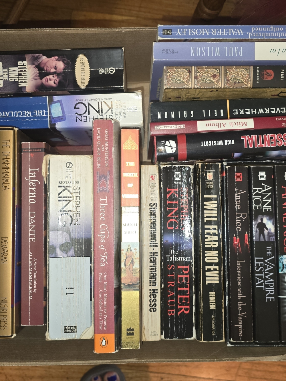 Assorted Paperback Books - Black and Multicolor Spines